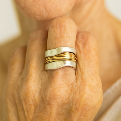Silver ring with golden threads
